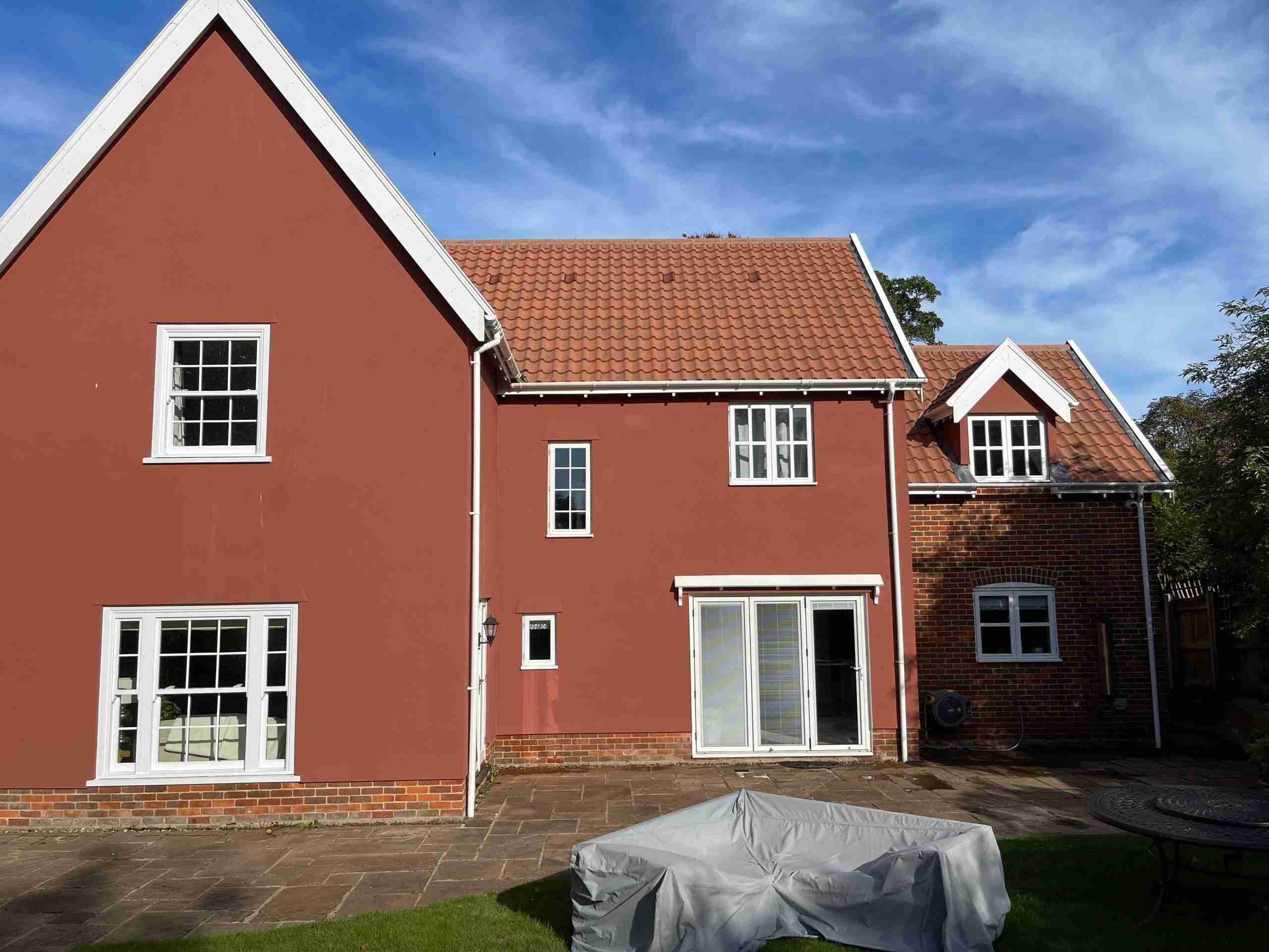After roof cleaning — moss removed, clean red tile roof in Newmarket, Suffolk.