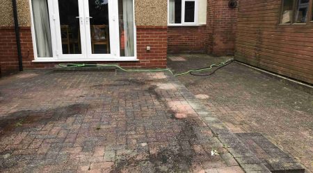 Oil stained block paving in Suffolk